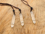 Clear Quartz bullet crystal necklace from GemstoneGO featuring a sleek, polished pendant on a delicate chain.