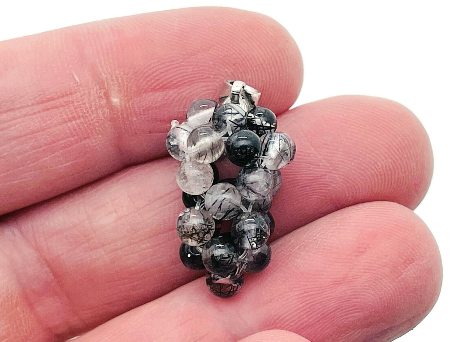 Tourmalinated Quartz crystal grape pendant from GemstoneGO, featuring a detailed gemstone cluster with black tourmaline inclusions.