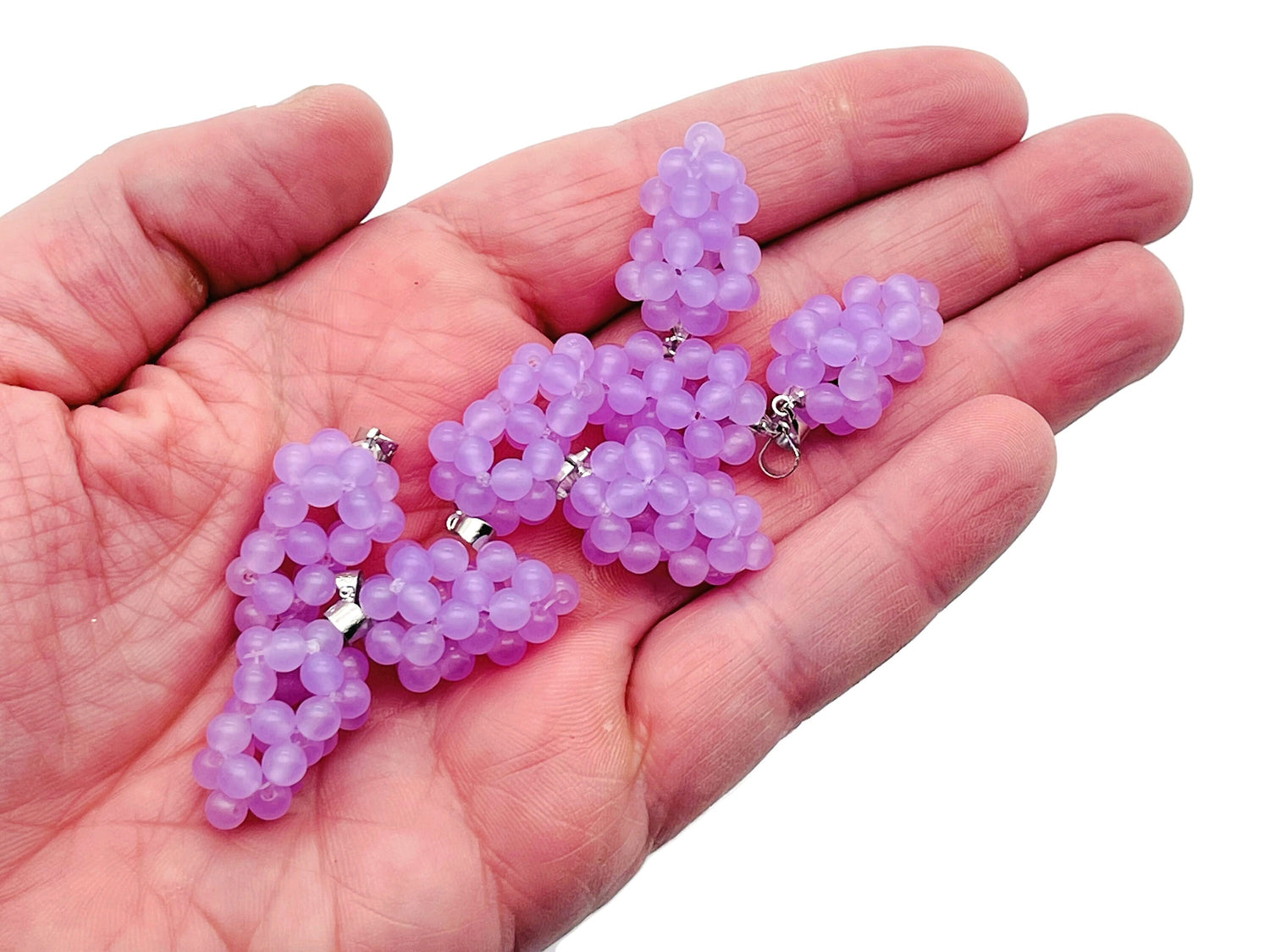 Purple agate grape crystal pendant by GemstoneGO featuring a detailed crystal grape design for jewelry and gift use.