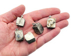 Pyrite crystal pendant from GemstoneGO featuring a strong protection stone with a metallic gold finish and natural crystal formation.