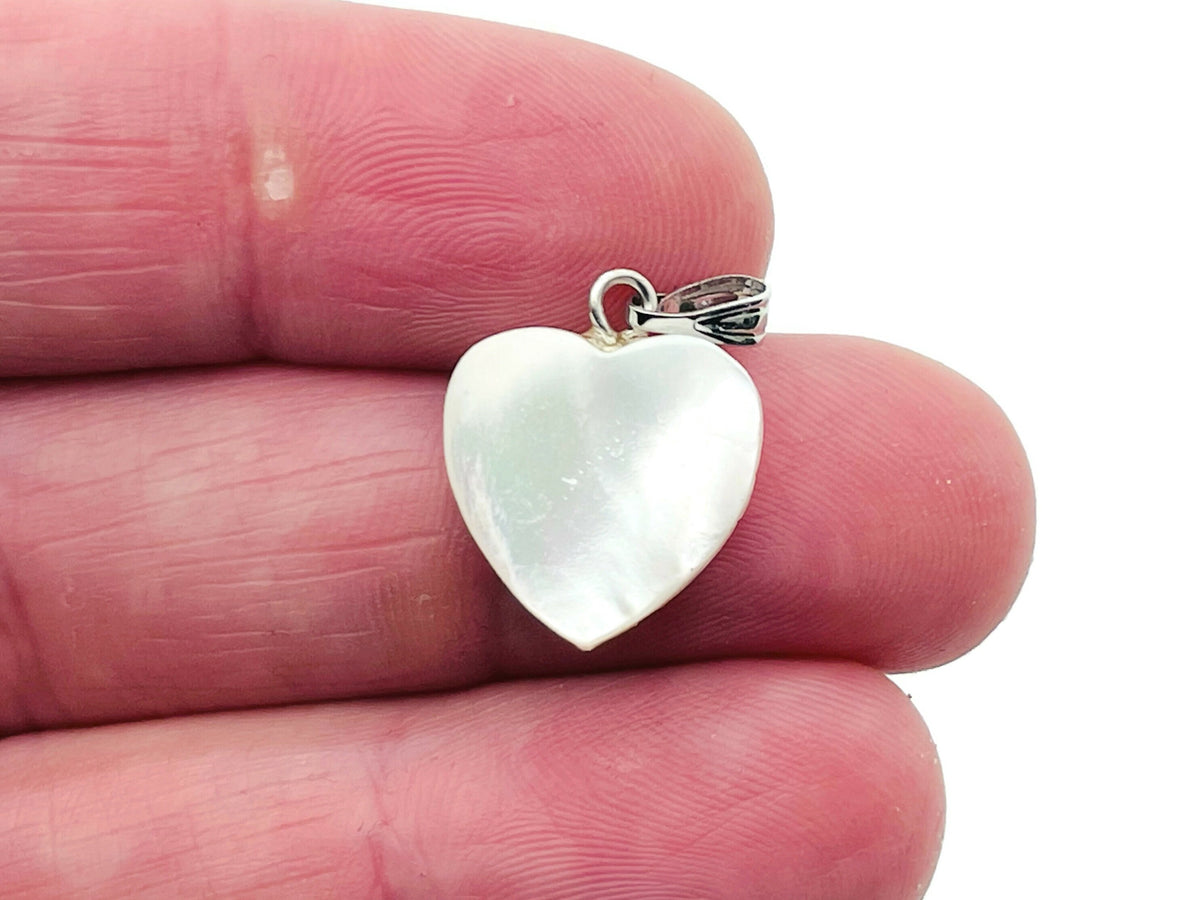 Natural pearl heart pendant with mini crystal accent from GemstoneGO, showcasing its elegant design and shimmering details.