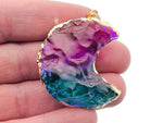 Blue and purple Rainbow Aura Moon crystal pendant with love stone design by GemstoneGO, showcasing its vibrant, iridescent finish.