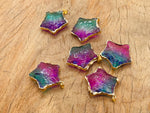 Purple and green rainbow aura star-shaped quartz crystal pendant from GemstoneGO, showcasing its vibrant, shimmering loose crystal design.