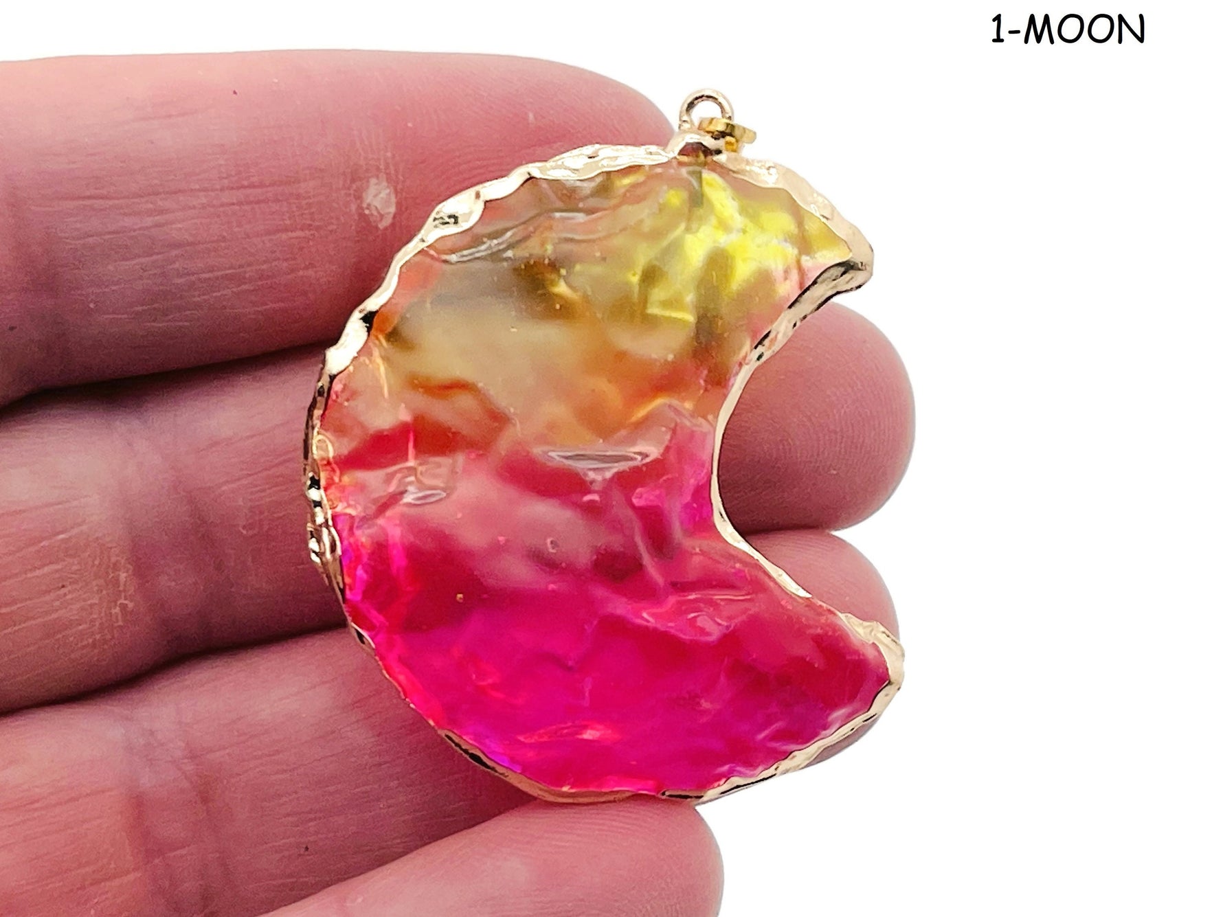 Rainbow Aura Heart Crystal pendant featuring moon, star, and heart shapes from GemstoneGO, showcasing vibrant, iridescent crystal details.