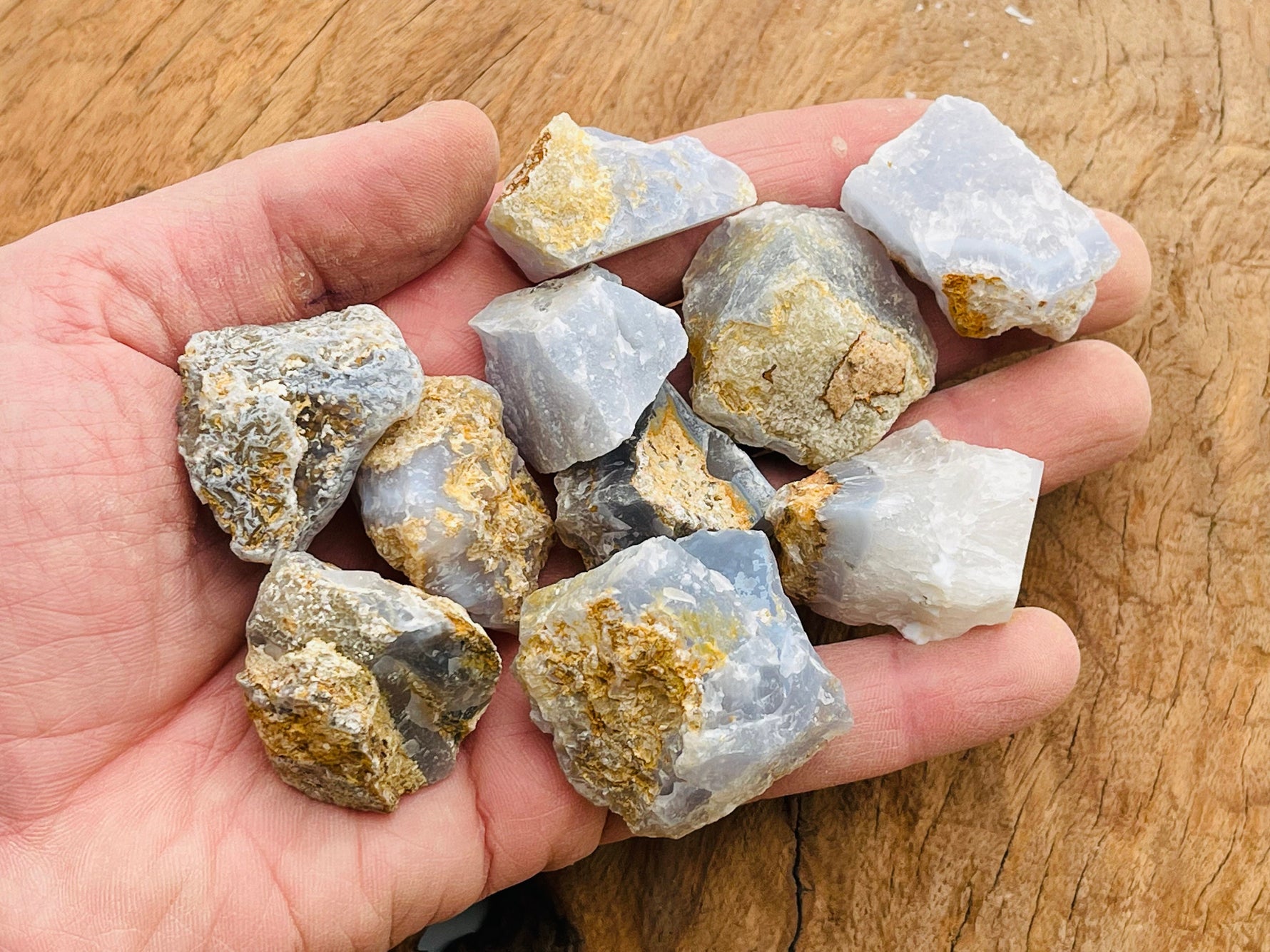 Raw Blue Lace Agate gemstone from GemstoneGO, showcasing its light blue, banded stone with natural texture and unique patterns.