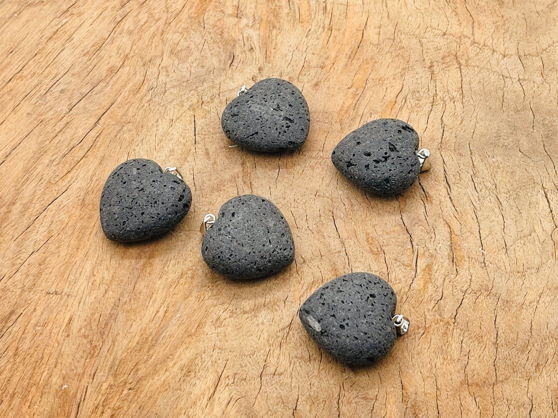 Lava heart pendant with gemstone, featuring a spiritual stone design from GemstoneGO, showcasing a close-up of the pendant's details.