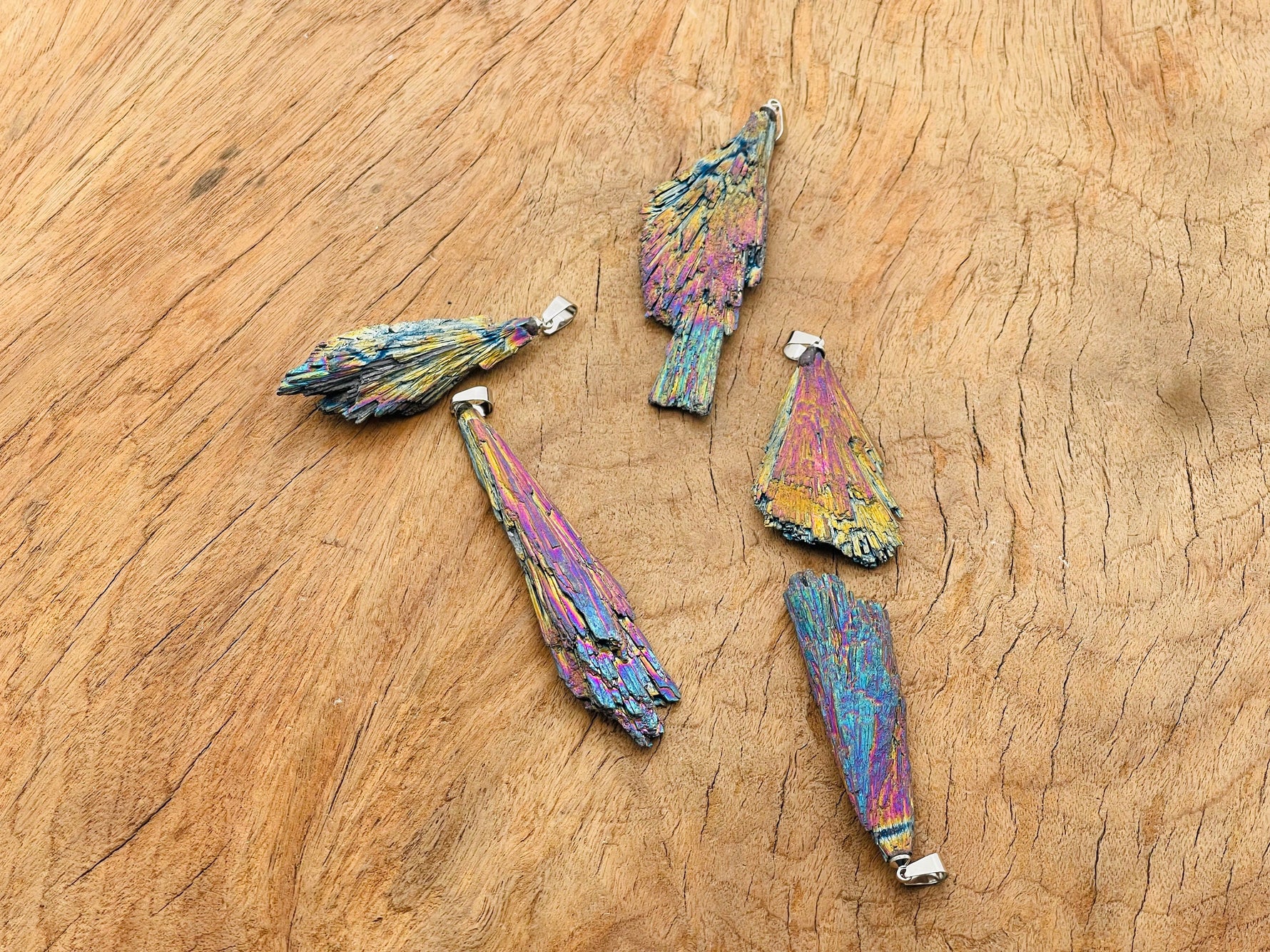 Rainbow Kyanite fan crystal pendant with titanium accents, showcasing vibrant, layered gemstone jewelry on a delicate chain.