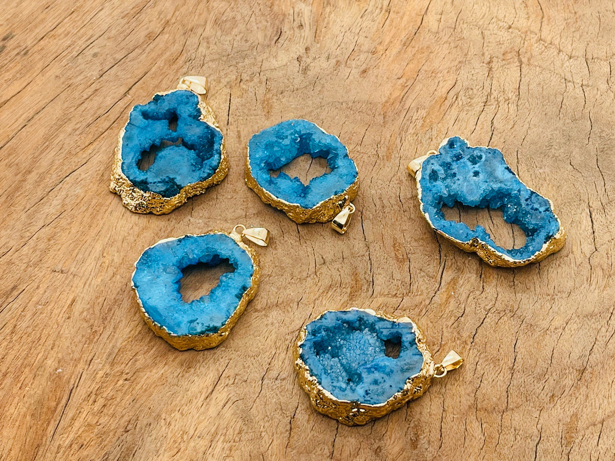 Blue agate geode druzy slice crystal pendant from GemstoneGO featuring a vibrant blue agate geode with sparkling druzy interior.