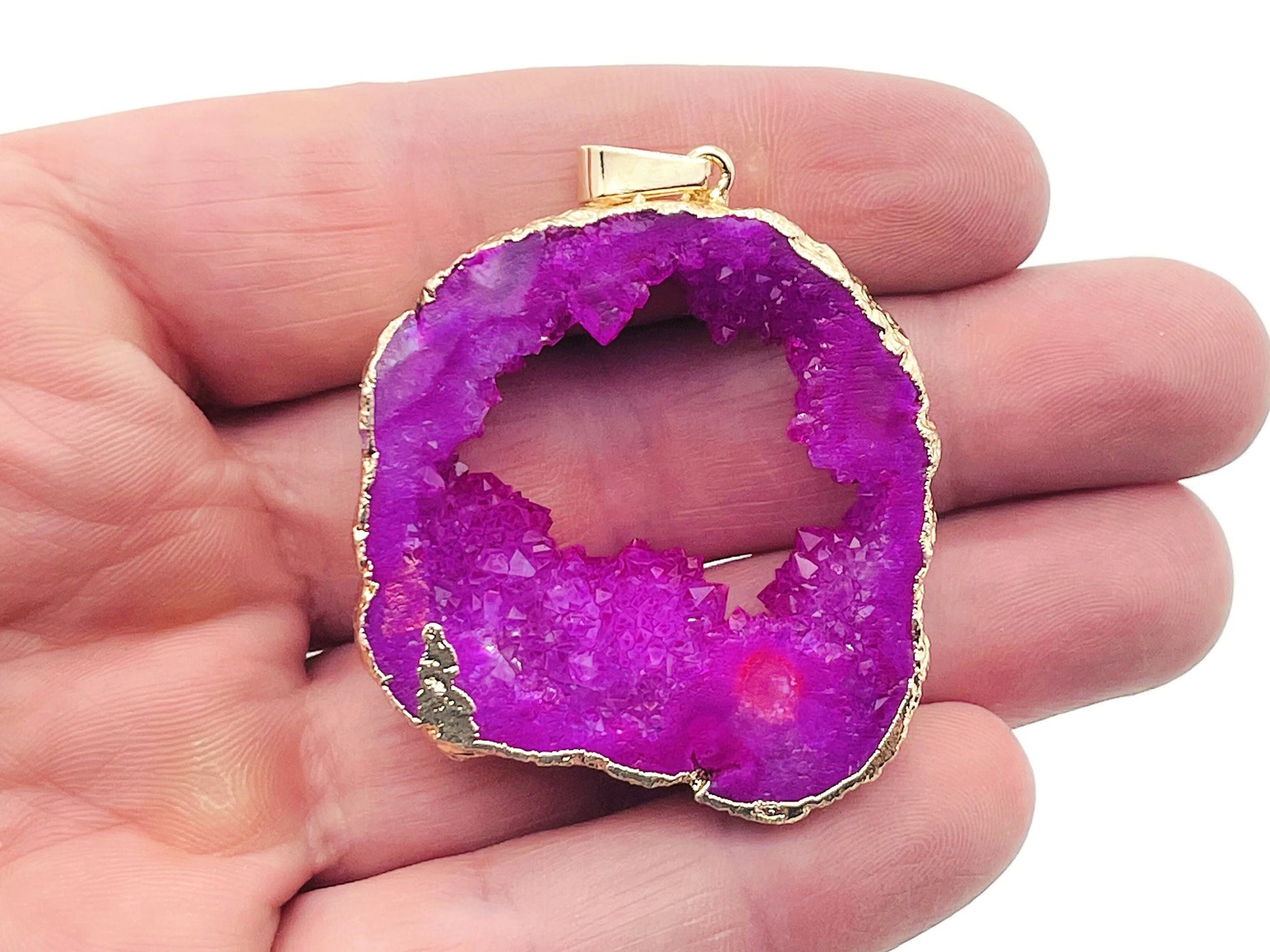 Pink agate geode druzy slice pendant with crystal detail, handcrafted gemstone jewelry by GemstoneGO featuring a unique geode design.