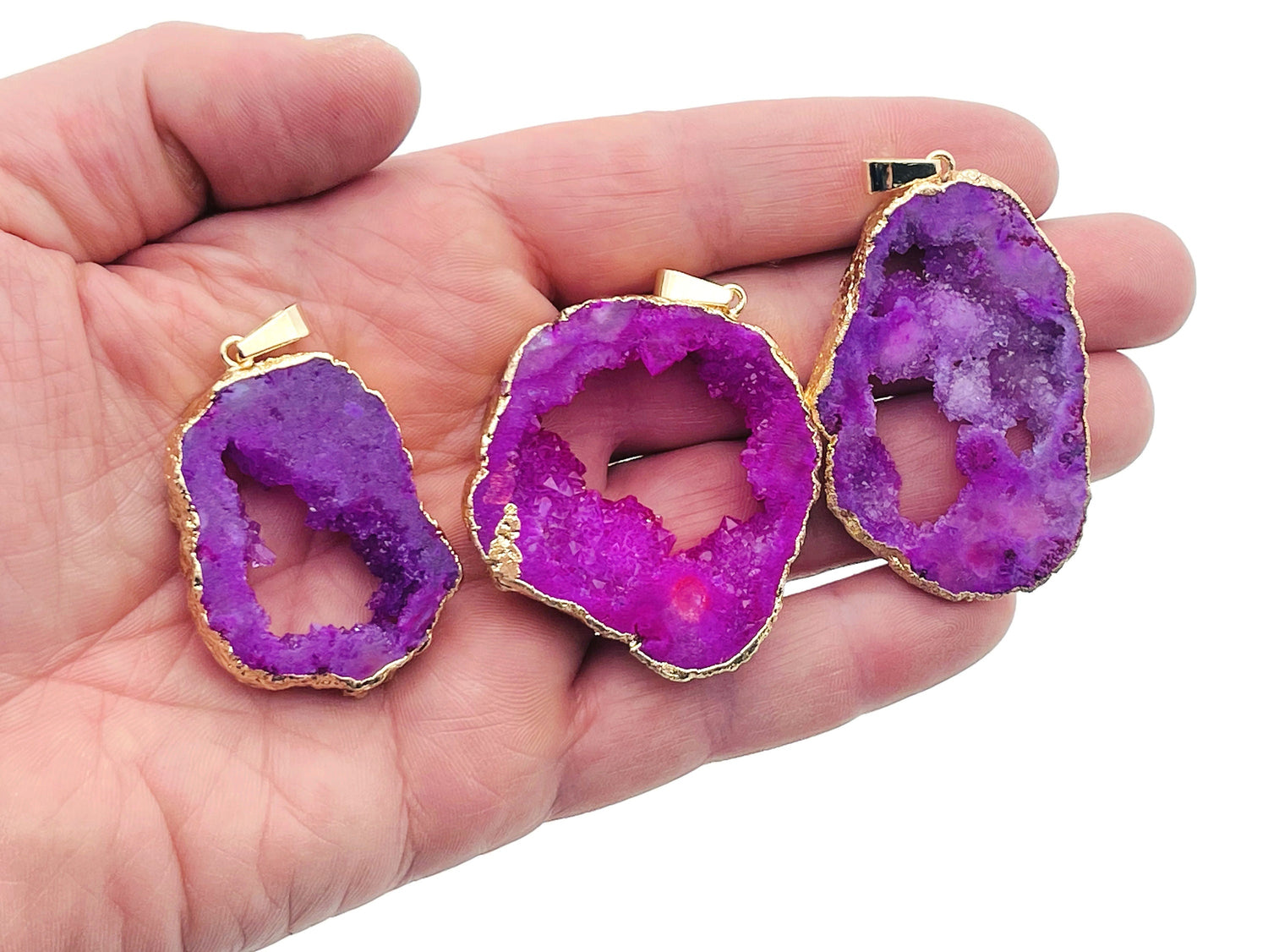 Pink agate geode druzy slice pendant with natural crystal formation, featuring a vibrant pink and white color pattern.