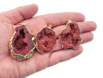 Red agate geode druzy slice crystal pendant from GemstoneGO featuring vibrant red hues and sparkling druzy details.