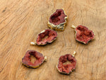 Red agate geode druzy slice crystal pendant from GemstoneGO, showcasing a vibrant red agate geode with sparkling druzy interior.