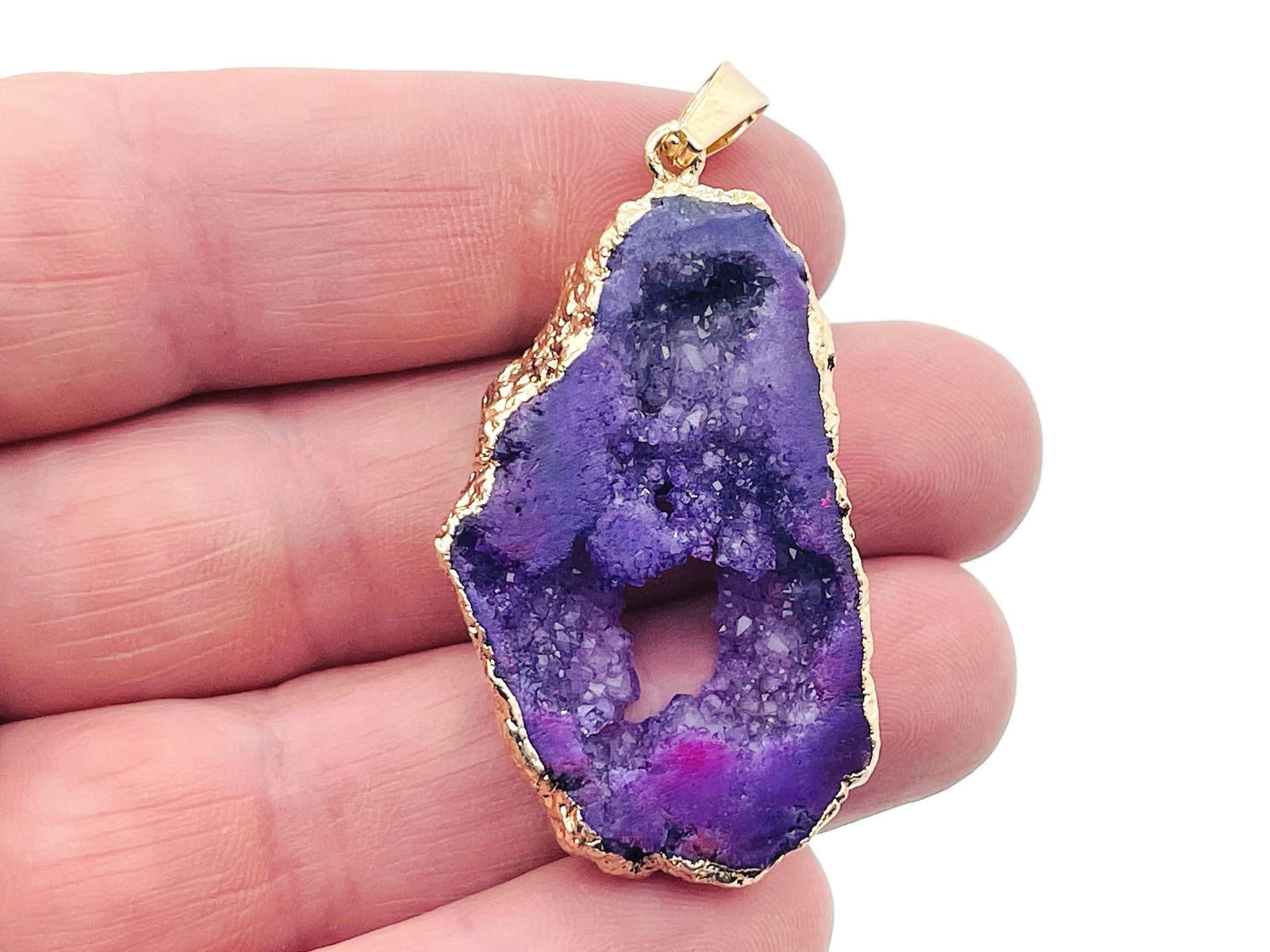 Purple agate geode druzy slice crystal pendant from GemstoneGO, showcasing a vibrant purple agate geode with sparkling druzy interior.