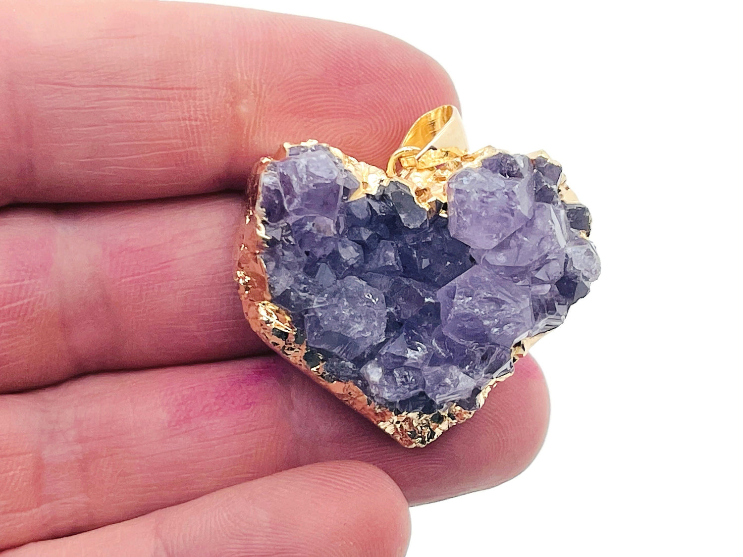 Amethyst heart cluster crystal pendant from GemstoneGO featuring a purple gemstone heart with natural crystal points on a silver chain