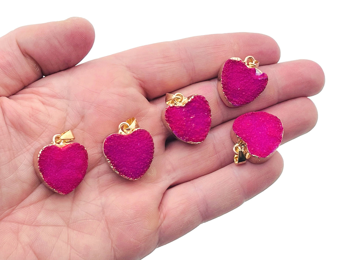 Pink agate heart geode pendant with druzy crystal detail, gemstone jewelry featuring a natural pink agate heart slice.
