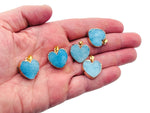 Blue agate heart geode pendant with druzy crystal slice, showcasing vibrant blue tones and natural gemstone details.