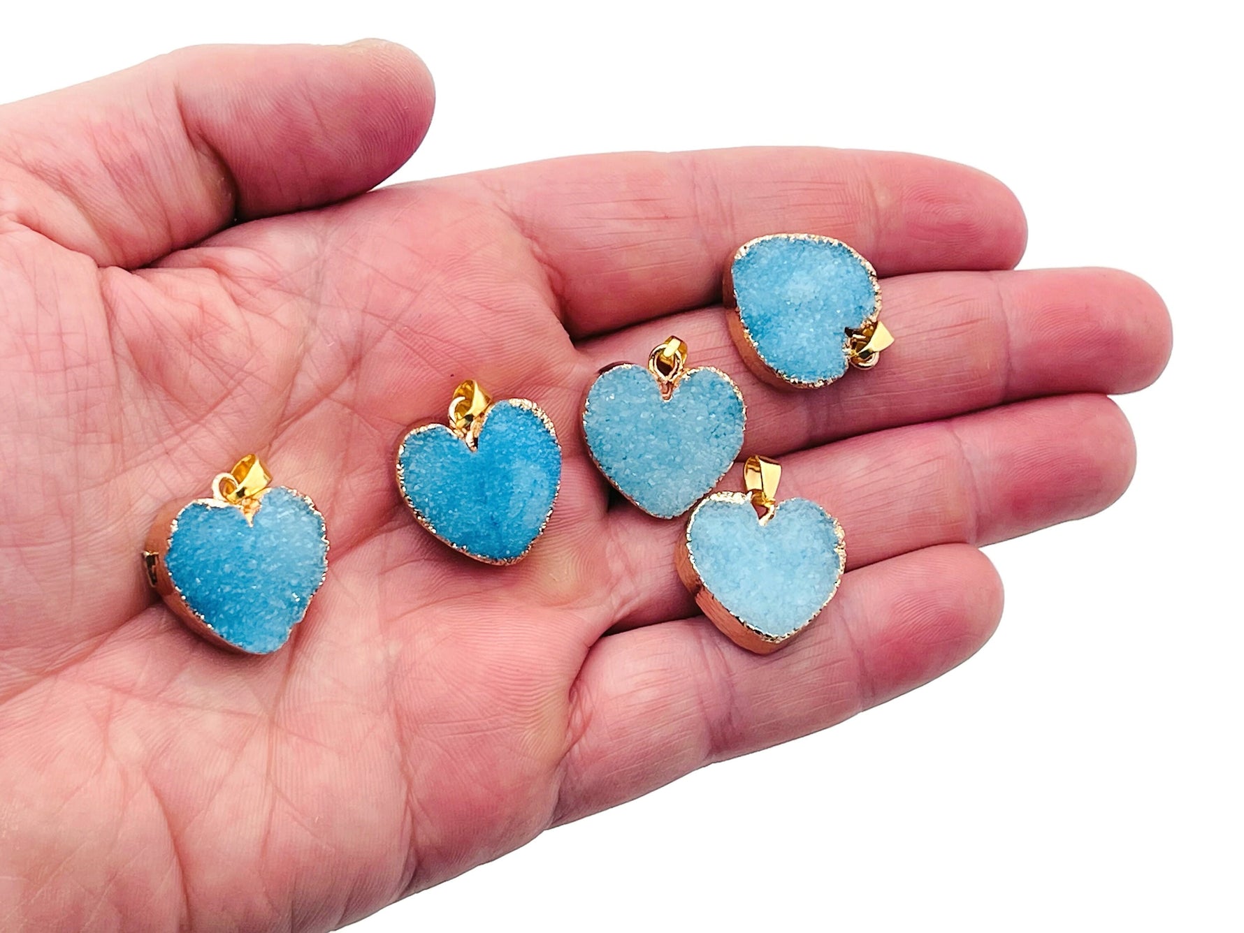 Blue agate heart geode pendant with druzy crystal slice, showcasing vibrant blue tones and natural gemstone details.