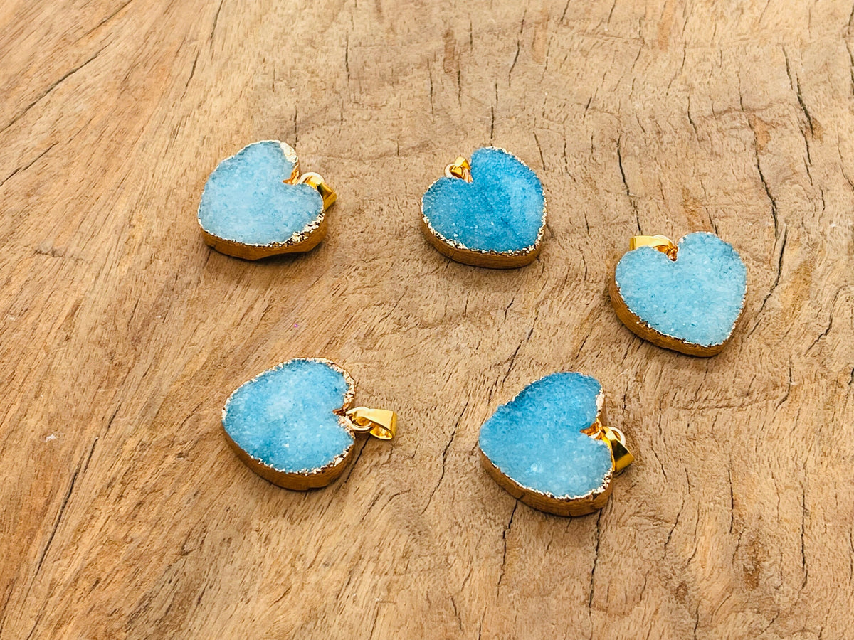 Blue agate heart geode pendant with druzy crystal slice, crafted by GemstoneGO, showcasing vibrant blue and glittering crystal details.