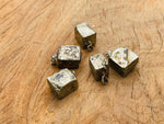 Pyrite crystal pendant from GemstoneGO featuring a metallic gold-toned stone, used as a protection gemstone.