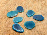 Blue agate slice with drilled hole, geode crystal pendant for jewelry making, showcasing vibrant blue and natural banding.