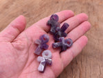 Amethyst Anka crystal carving from GemstoneGO, 30mm gemstone ankh symbol with purple amethyst hue, detailed gemstone craftsmanship.