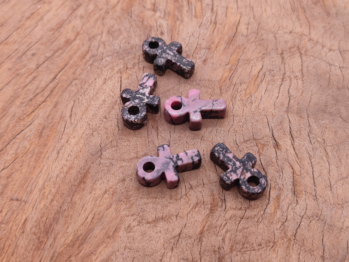 Rhodonite Anka crystal carving, gemstone ankh pendant, 30mm, with polished pink and black gemstone details.