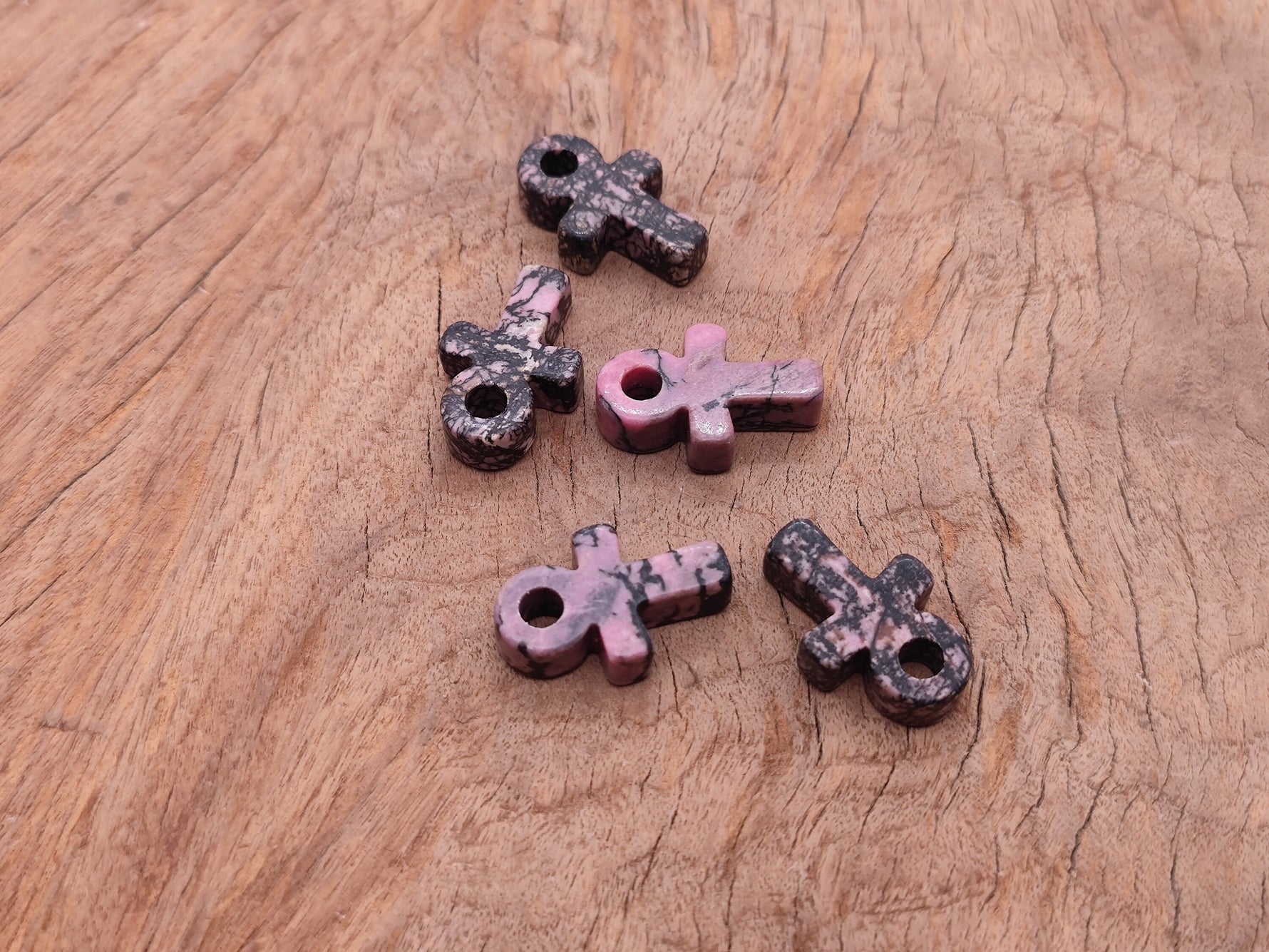 Rhodonite Anka crystal carving, gemstone ankh pendant, 30mm, with polished pink and black gemstone details.