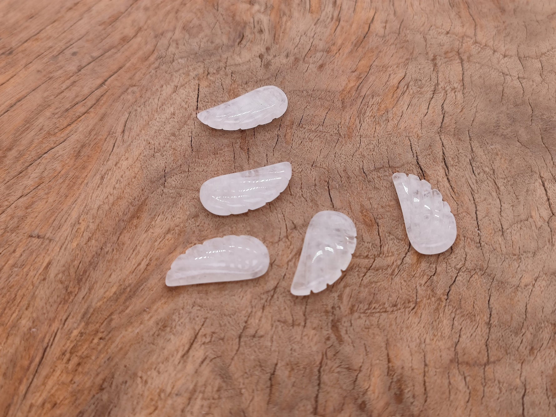 Clear Quartz angel wing pendant with hole charm from GemstoneGO, showcasing a detailed angel wing crystal design.