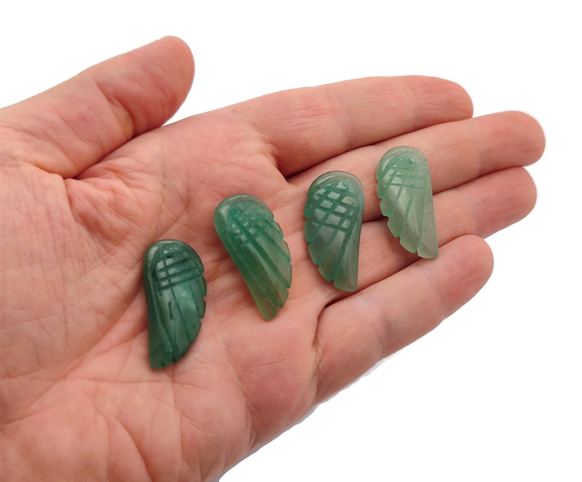 Aventurine angel wing crystal pendant with hole charm, featuring green gemstone details and intricate wing design.