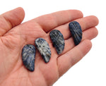 Sodalite Angel Wing crystal pendant with hole charm, featuring detailed blue and white stone design on a silver chain.