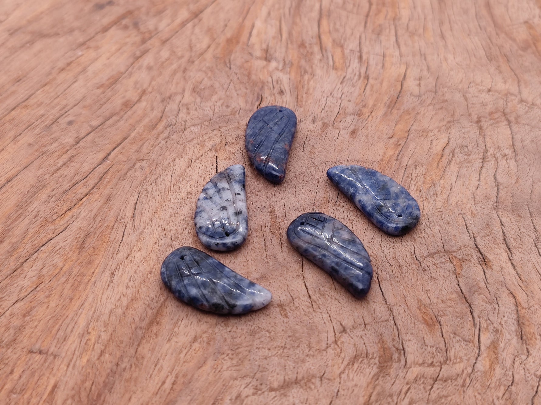 Sodalite angel wing crystal pendant with hole charm, showcasing blue and white gemstone details, handcrafted by GemstoneGO.