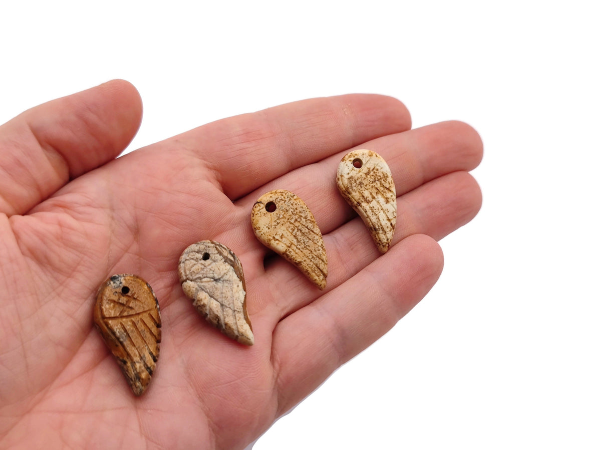 Picture Jasper Angel Wing crystal pendant with hole charm from GemstoneGO, showcasing a detailed angel wing design and natural stone appearance.