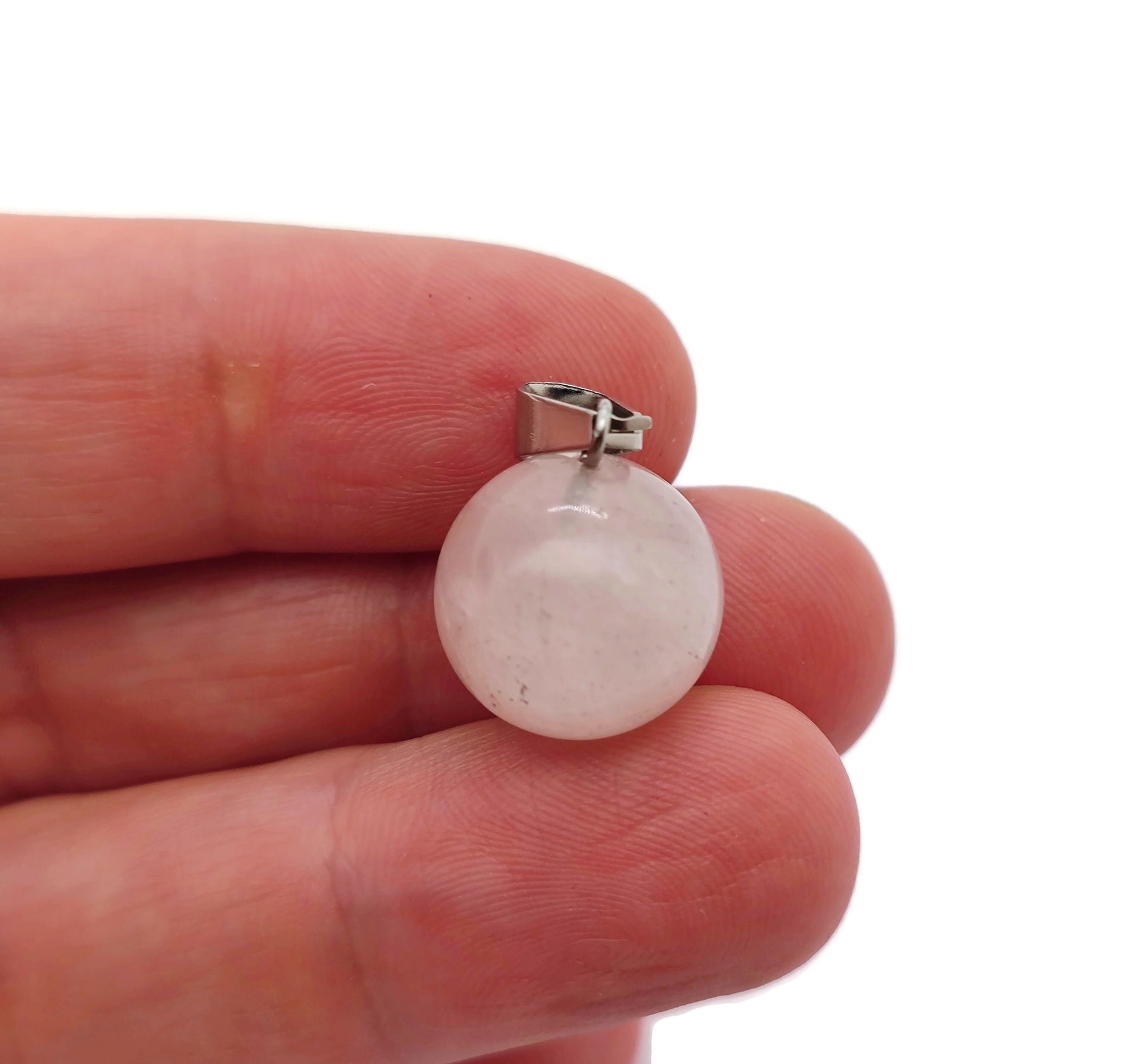 Rose Quartz crystal ball pendant from GemstoneGO, featuring a smooth round gemstone for jewelry making and decorative use.