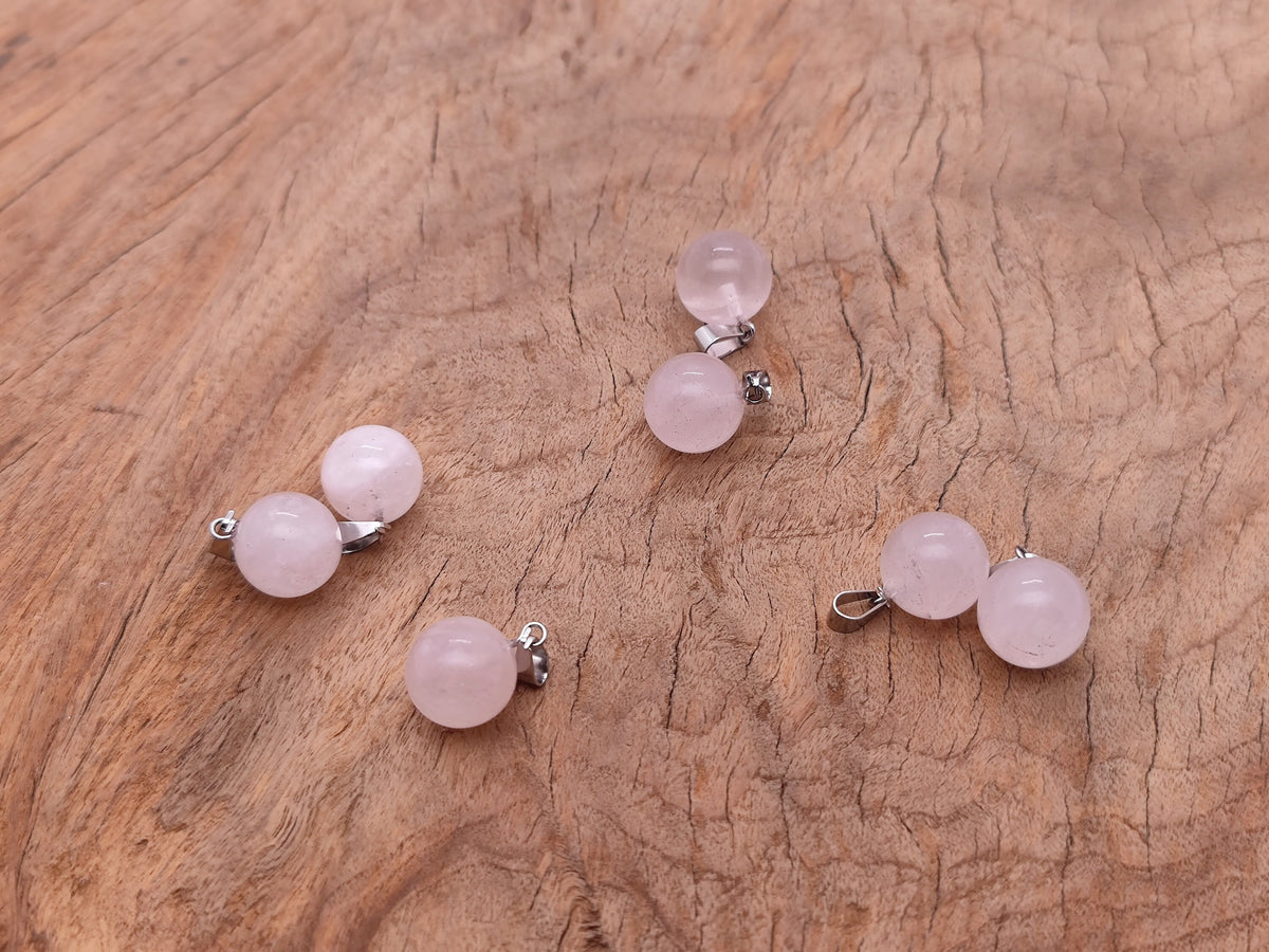 Rose quartz crystal ball pendant from GemstoneGO featuring a smooth round gemstone suitable for jewelry making.