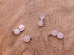 Rose quartz crystal ball pendant from GemstoneGO featuring a smooth round gemstone suitable for jewelry making.