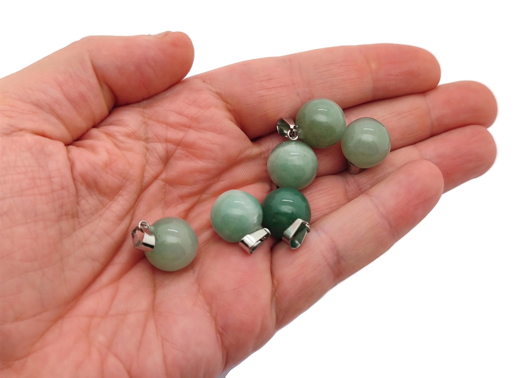 Aventurine crystal ball pendant with a smooth round shape, perfect for jewelry making, displayed against a neutral background.