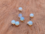 Opalite crystal ball pendant from GemstoneGO, round gemstone jewelry making accessory with smooth, polished surface.