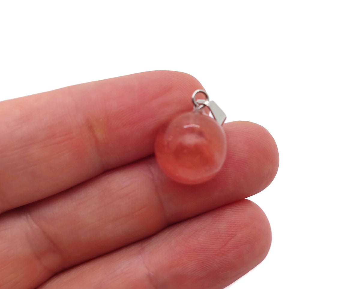 Cherry Quartz crystal ball pendant by GemstoneGO, showcasing a polished round cherry quartz gemstone for jewelry making.