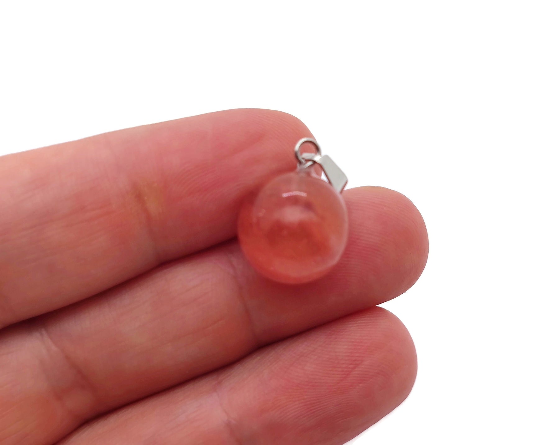Cherry Quartz crystal ball pendant by GemstoneGO, showcasing a polished round cherry quartz gemstone for jewelry making.