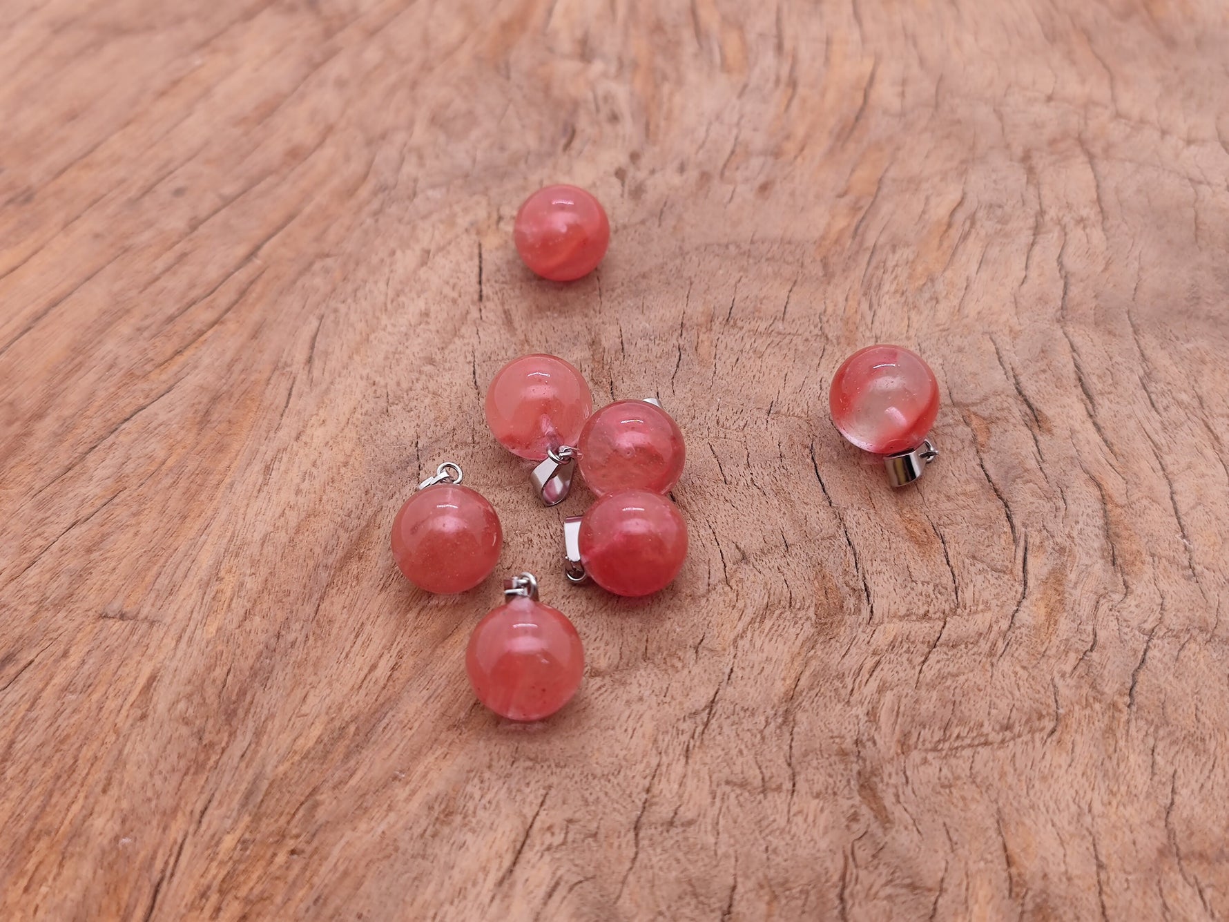 Cherry Quartz ball crystal pendant from GemstoneGO, round gemstone jewelry making pendant with polished cherry-colored quartz.