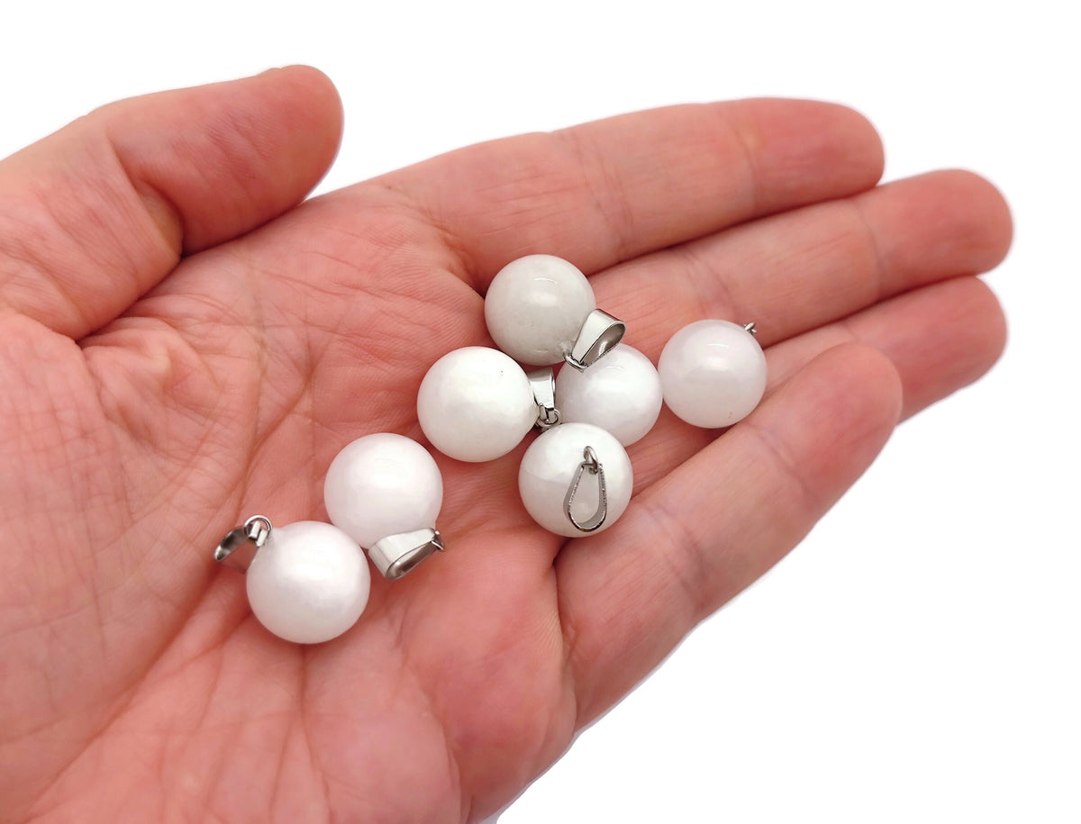 White jade ball crystal pendant from GemstoneGO, round jewelry-making pendant with smooth, polished surface, suitable for necklaces.