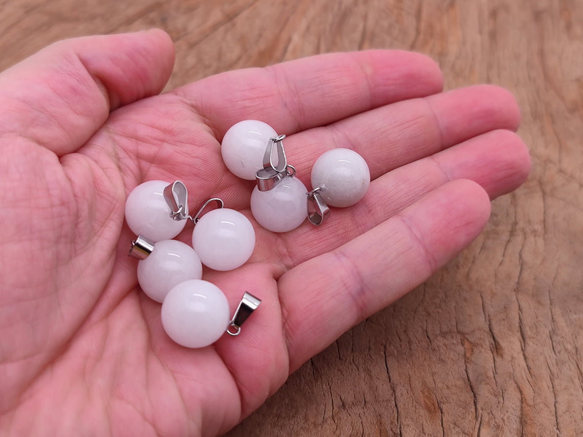 White jade crystal pendant featuring a round ball design, perfect for jewelry making and gemstone jewelry creation.
