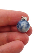 Blue Spot Jasper crystal ball pendant from GemstoneGO, showcasing a round gemstone jewelry making component with vivid blue spots.