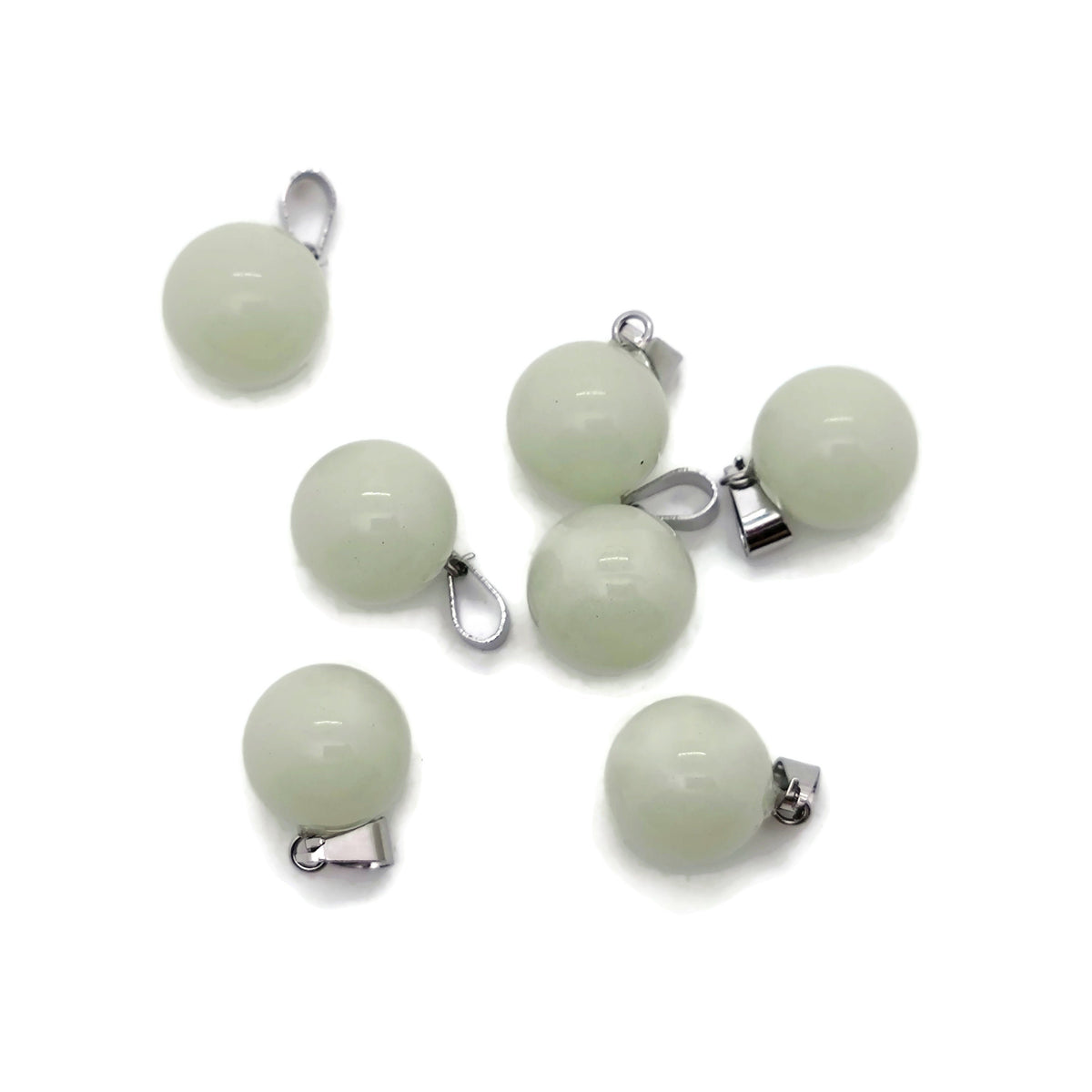 Luminous crystal round ball pendant, gemstone jewelry making, transparent glass or crystal design with reflective surface.