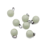 Luminous crystal round ball pendant, gemstone jewelry making, transparent glass or crystal design with reflective surface.