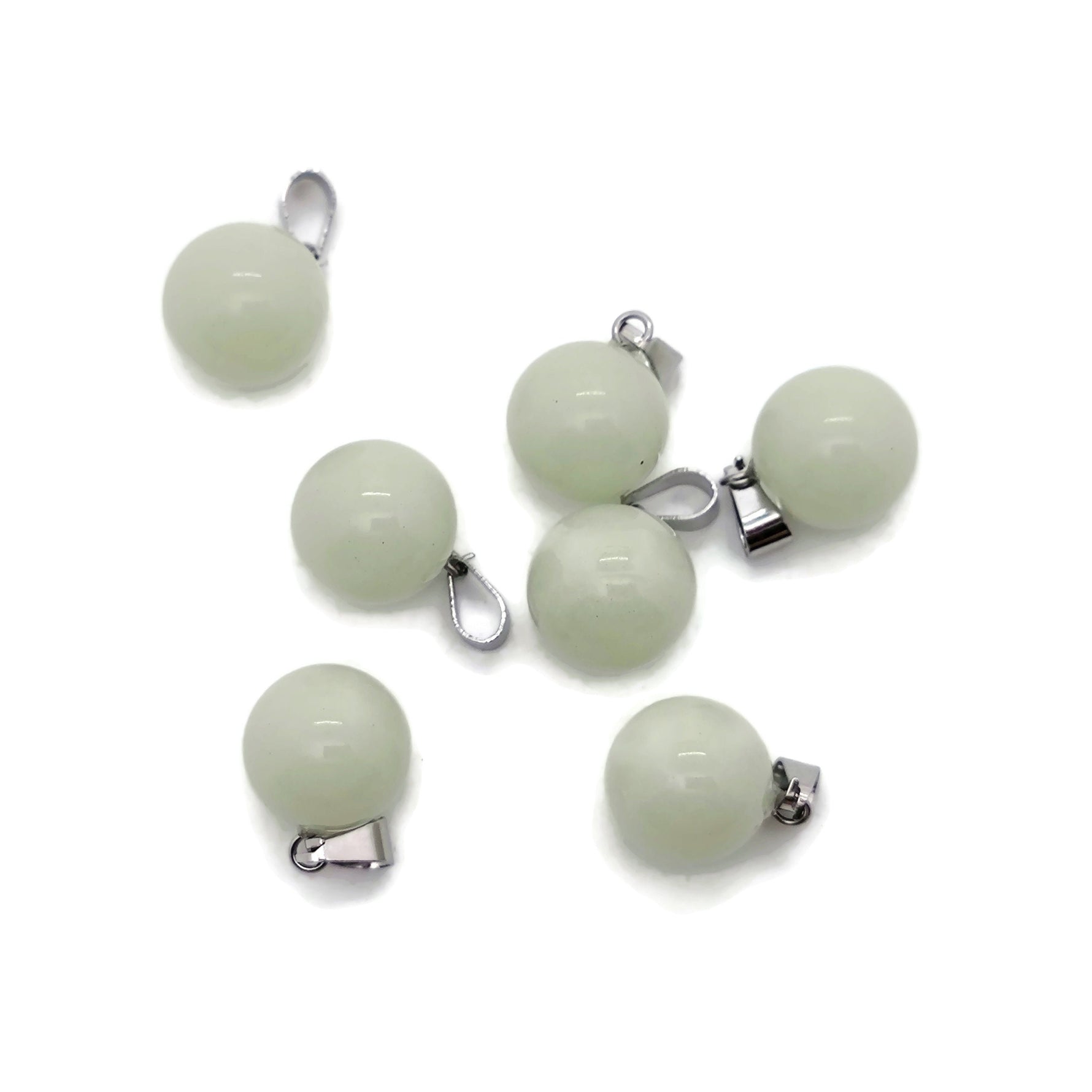 Luminous crystal round ball pendant, gemstone jewelry making, transparent glass or crystal design with reflective surface.
