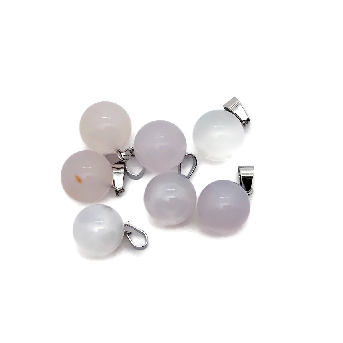White agate crystal ball pendant showing a smooth, round gemstone with a silver bail for jewelry making.