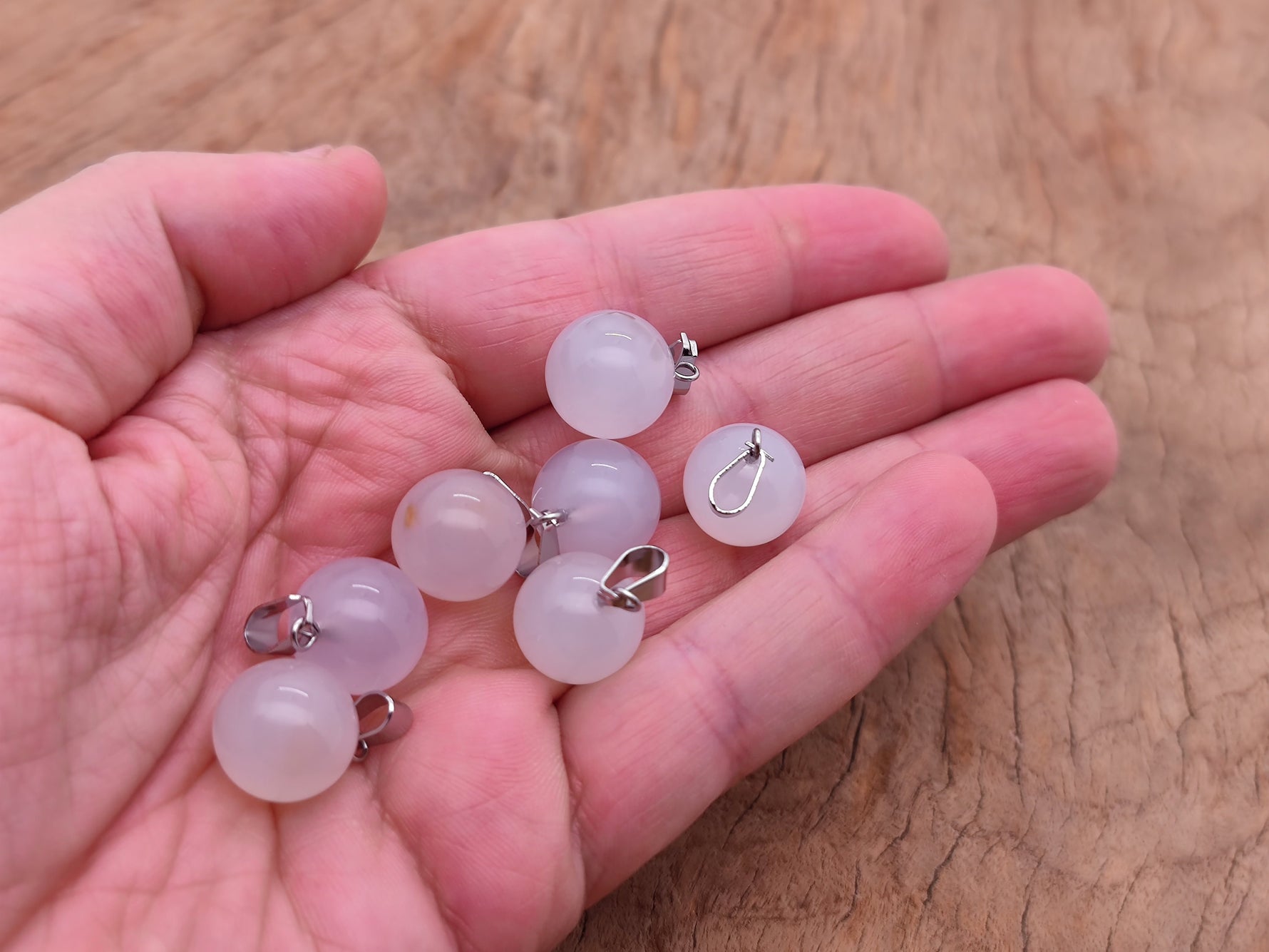 White agate crystal ball pendant with smooth round shape, ideal for jewelry making, from GemstoneGO.