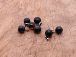 Black agate crystal ball pendant from GemstoneGO, round gemstone jewelry making accessory with polished smooth surface.