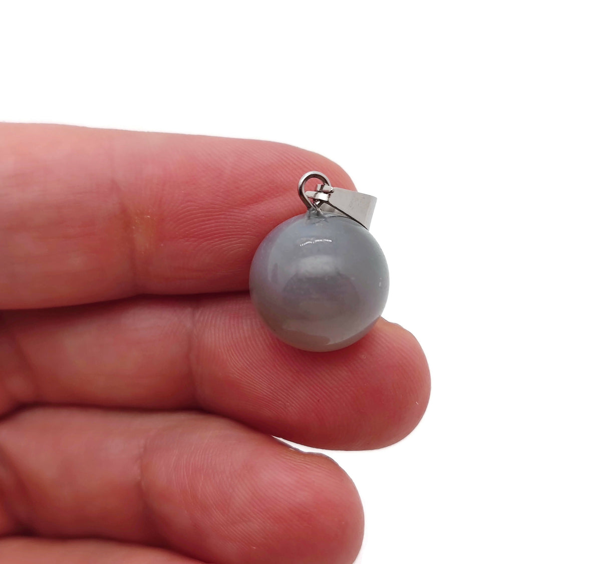Grey agate crystal ball pendant from GemstoneGO, round gemstone jewelry making accessory with polished smooth surface.